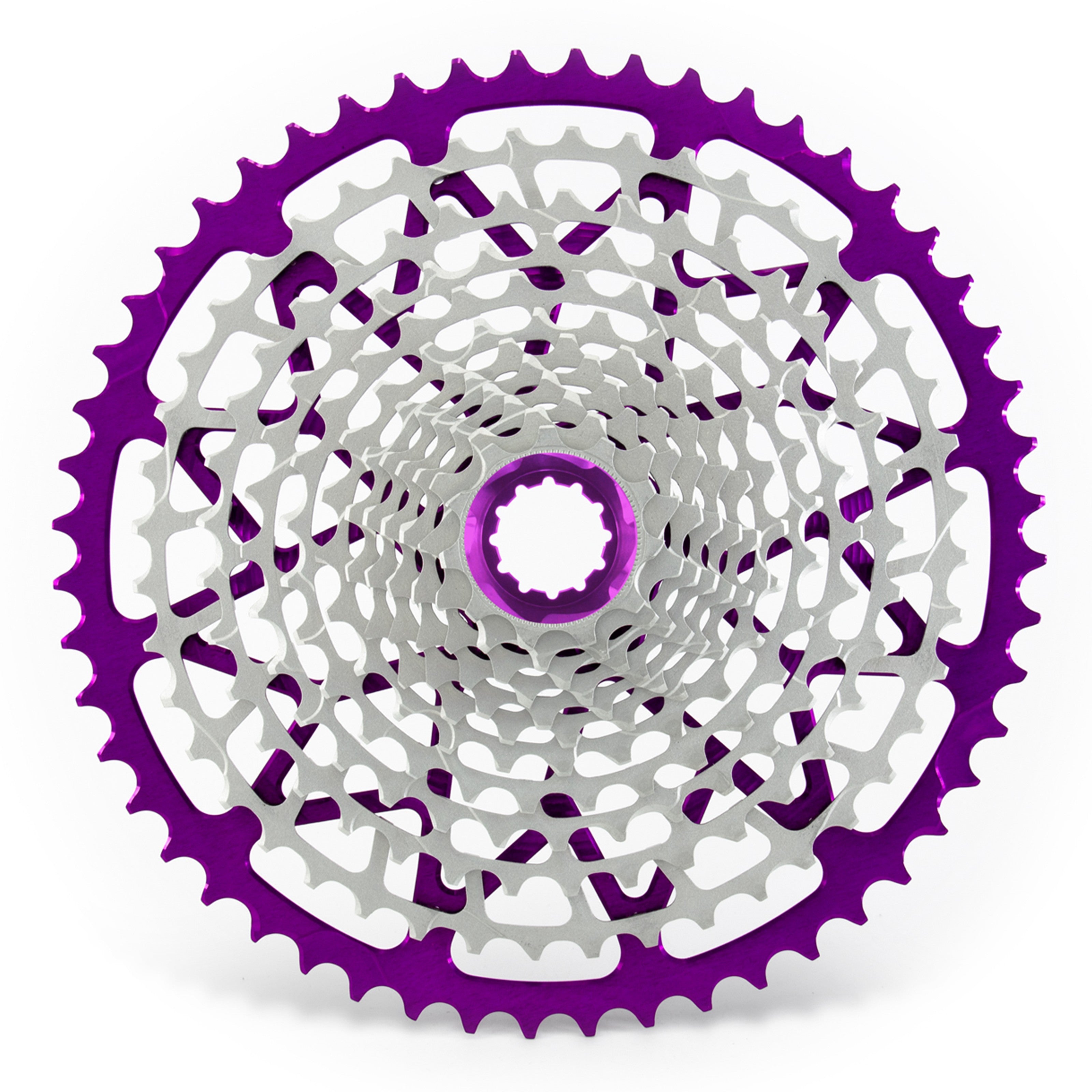 Garbaruk 12sp cassette Shimano in violet, highlighting the CNC-machined monoblock construction and unique tooth profiling