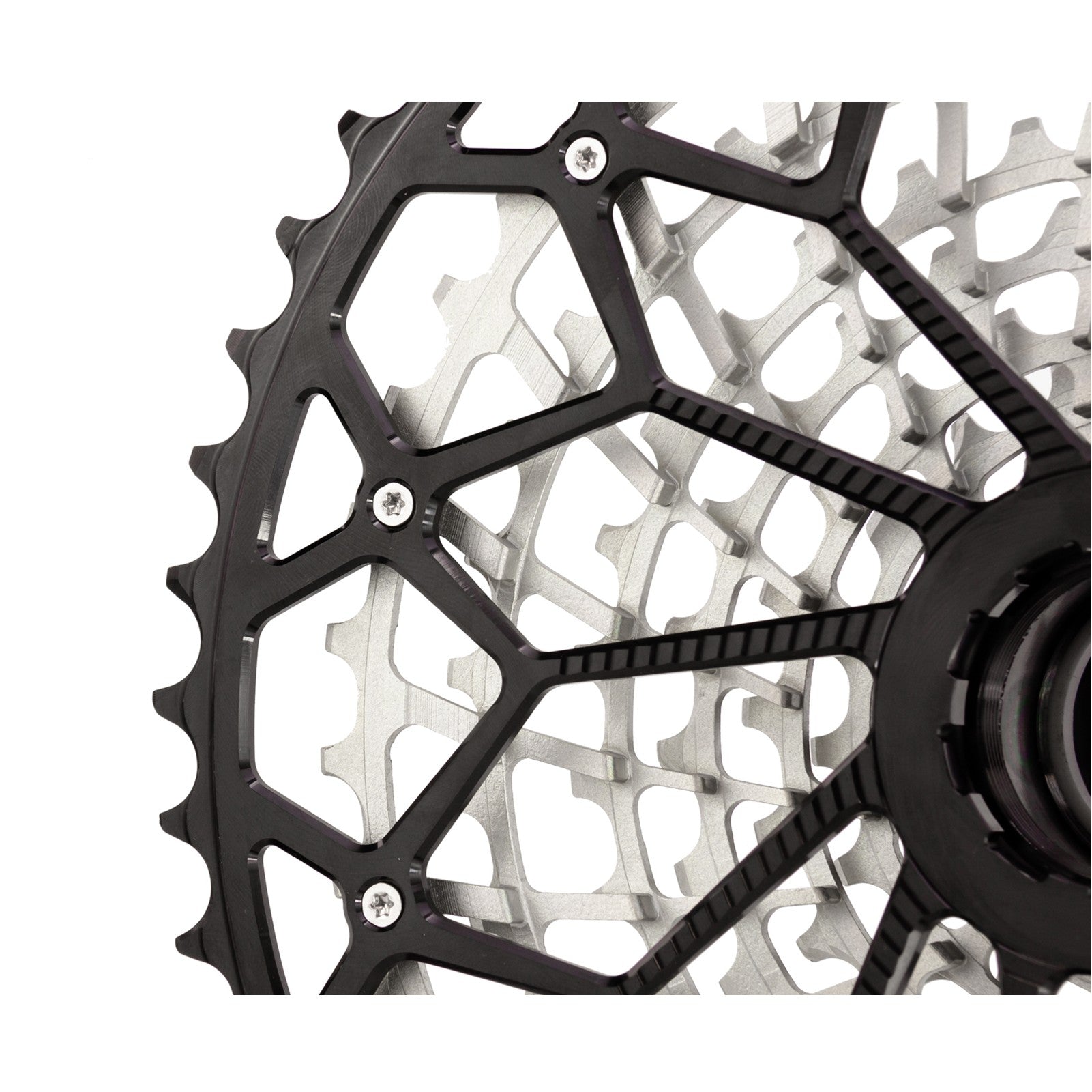 Close-up rear detail on a Garbaruk 11-speed SRAM XD freehub cassette in black, showing the largest anodised cog, bolted to the rest of the cassette body