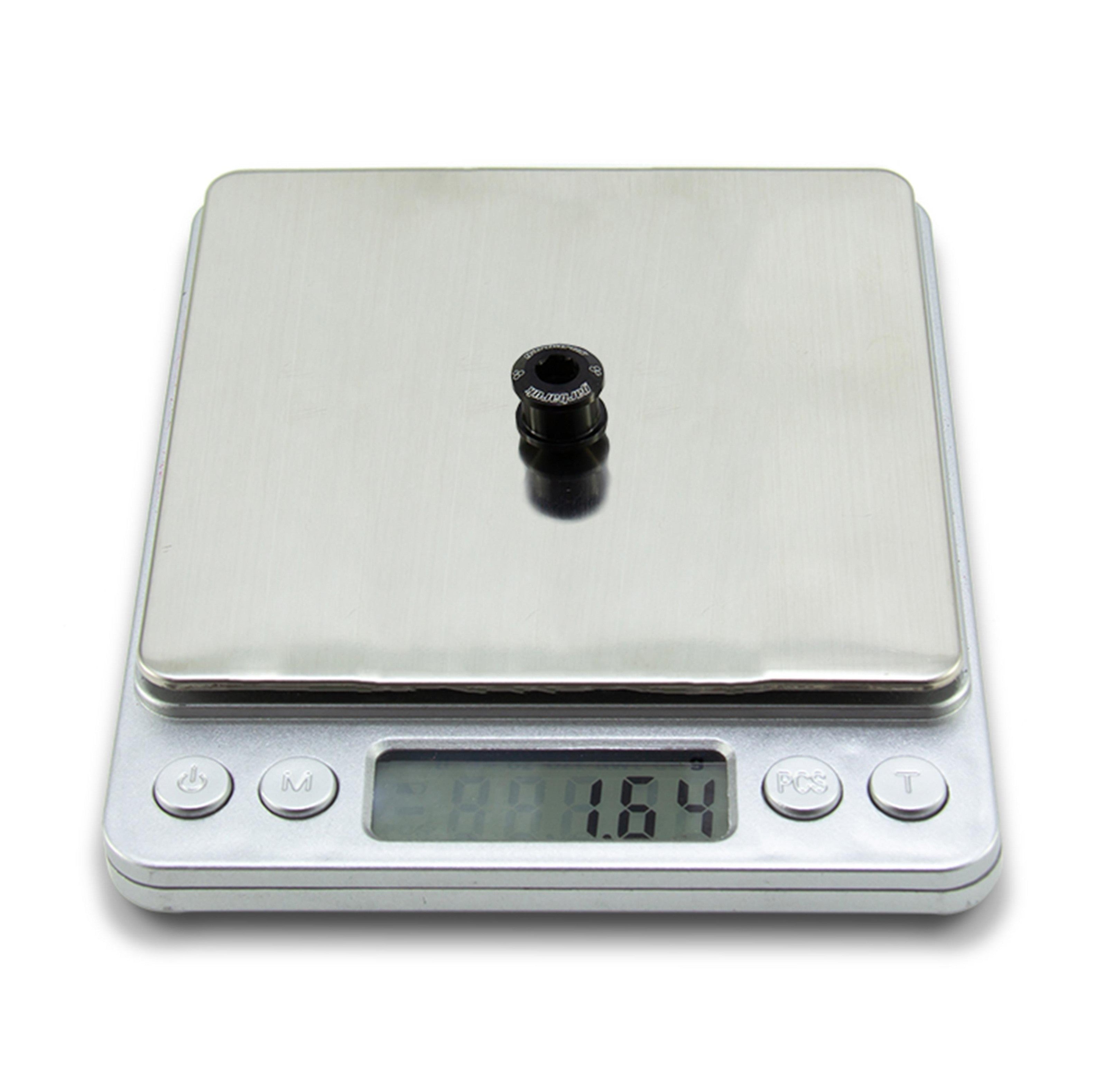 Black Garbaruk chainring bolt on digital scale showing individual weight (1.64g)