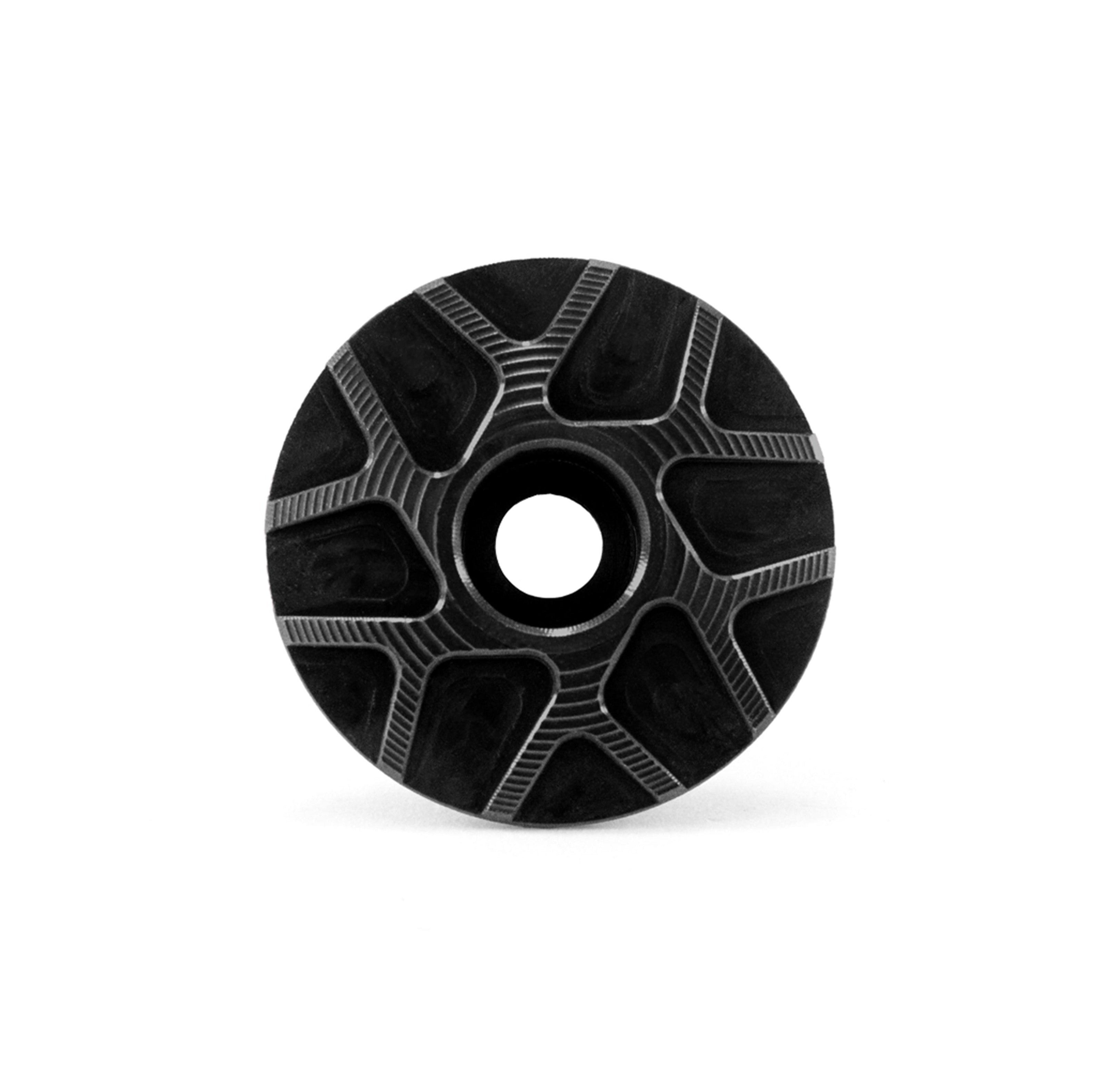 Garbaruk stem cap in black, showcasing CNC-machined detailing and precision-engineered finish