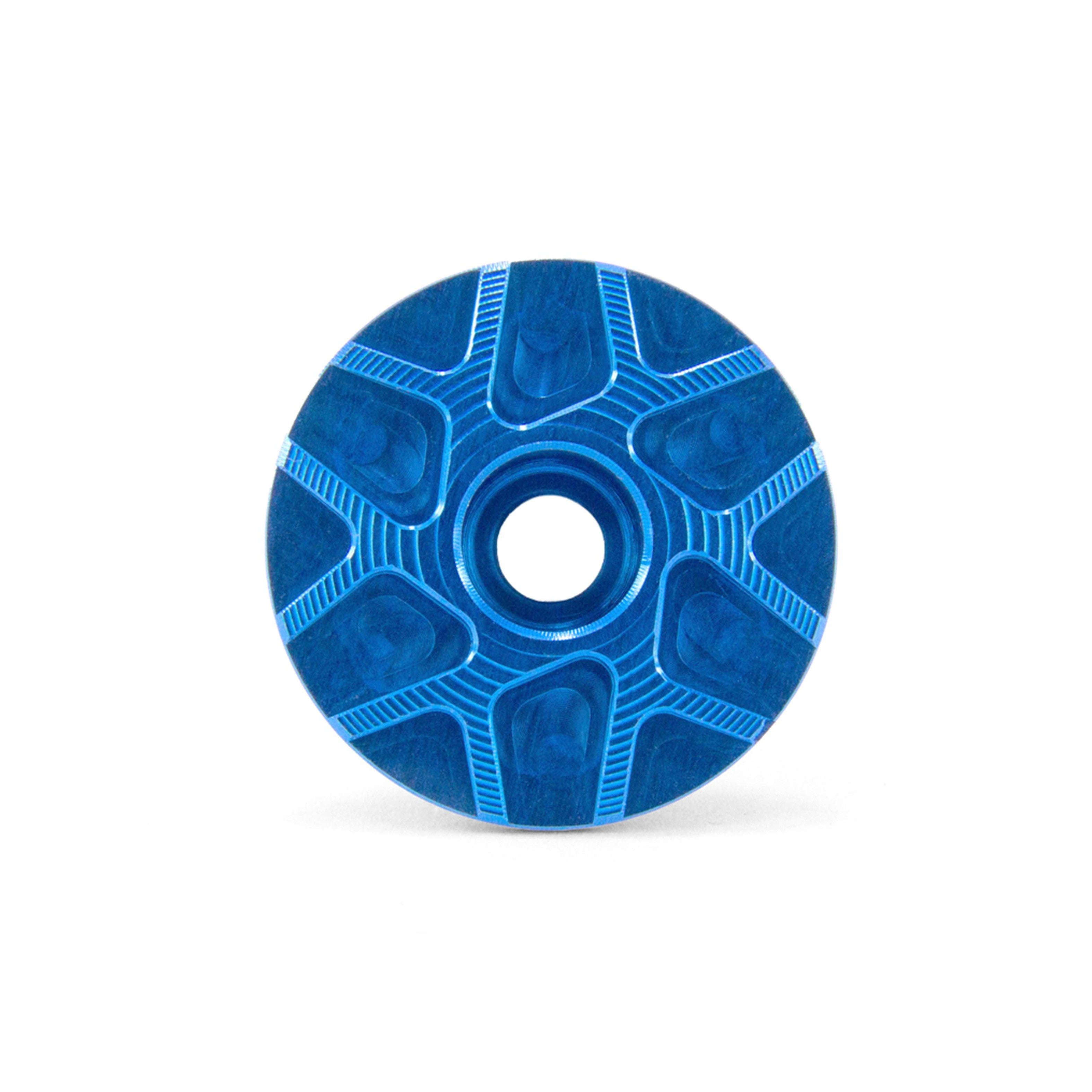 Garbaruk stem cap in blue, showcasing CNC-machined detailing and precision-engineered finish