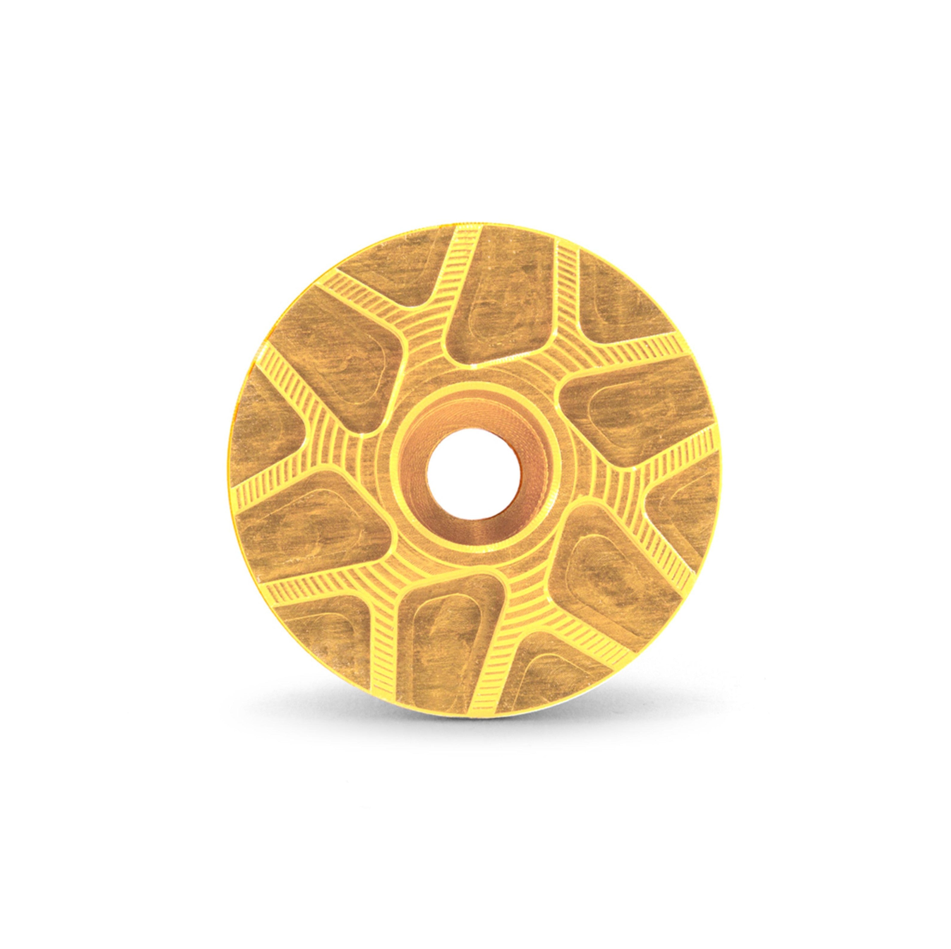 Garbaruk stem cap in gold, showcasing CNC-machined detailing and precision-engineered finish