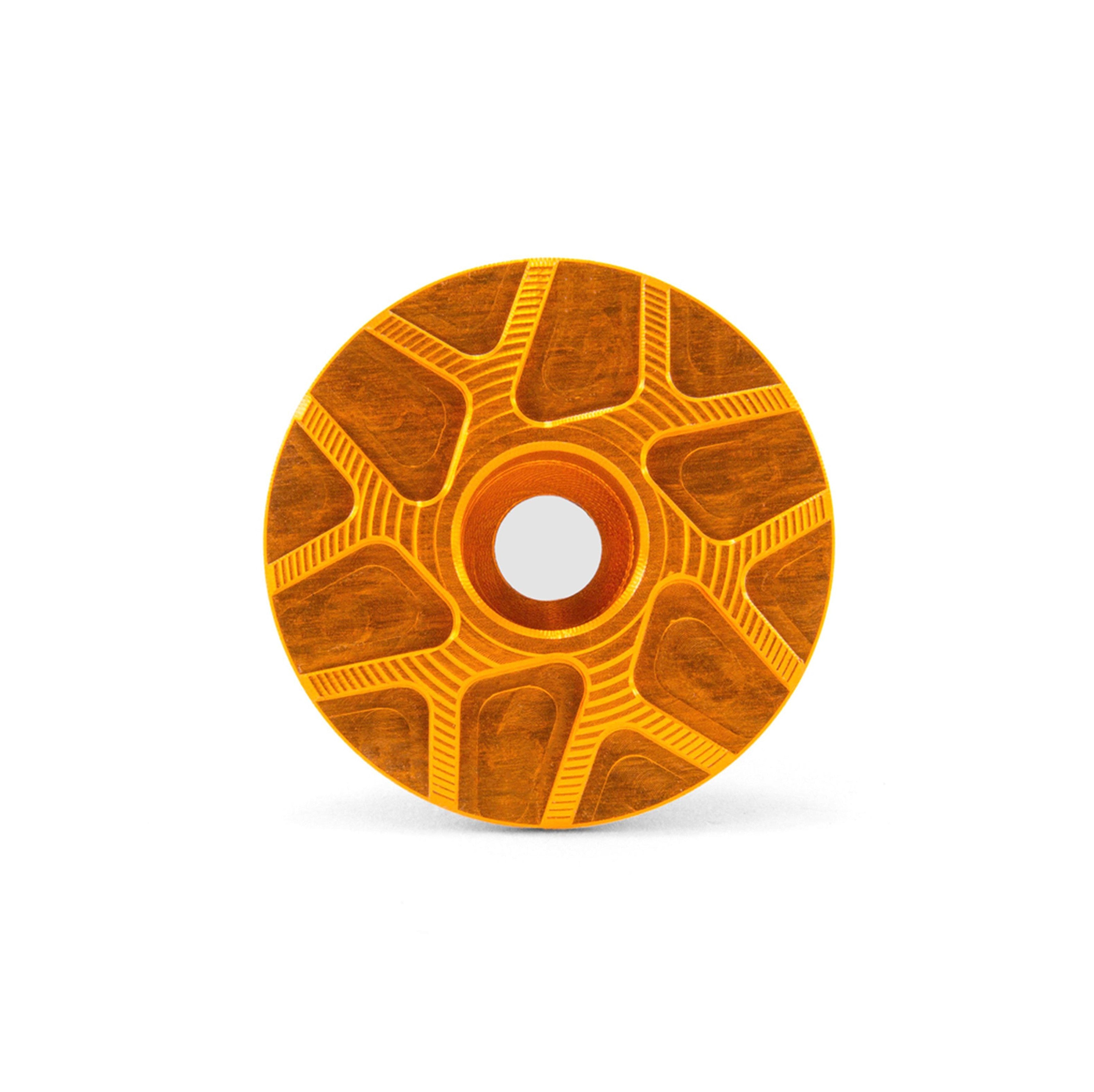 Garbaruk top cap in orange, showcasing CNC-machined detailing and precision-engineered finish