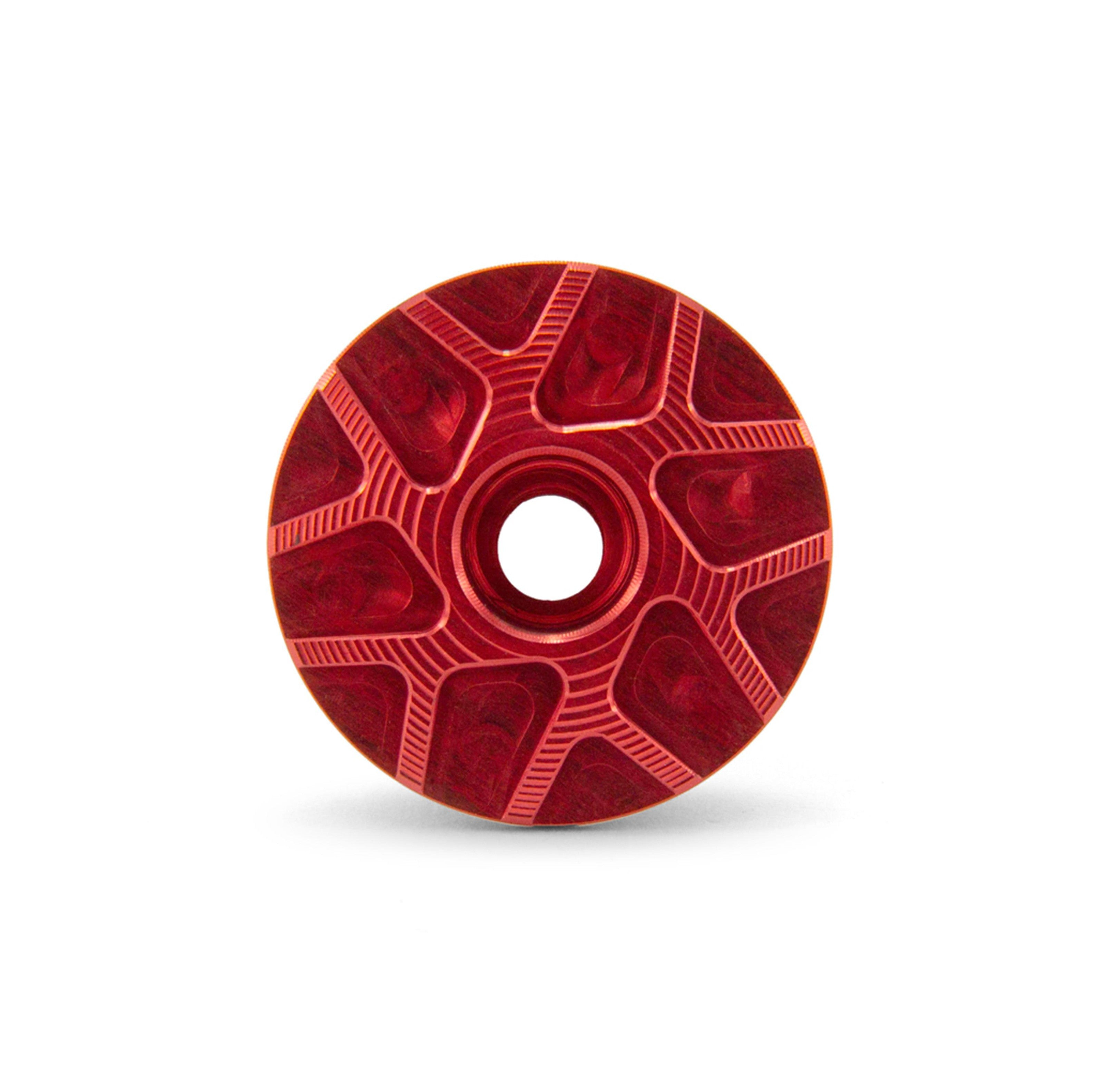 Garbaruk top cap in red, showcasing CNC-machined detailing and precision-engineered finish