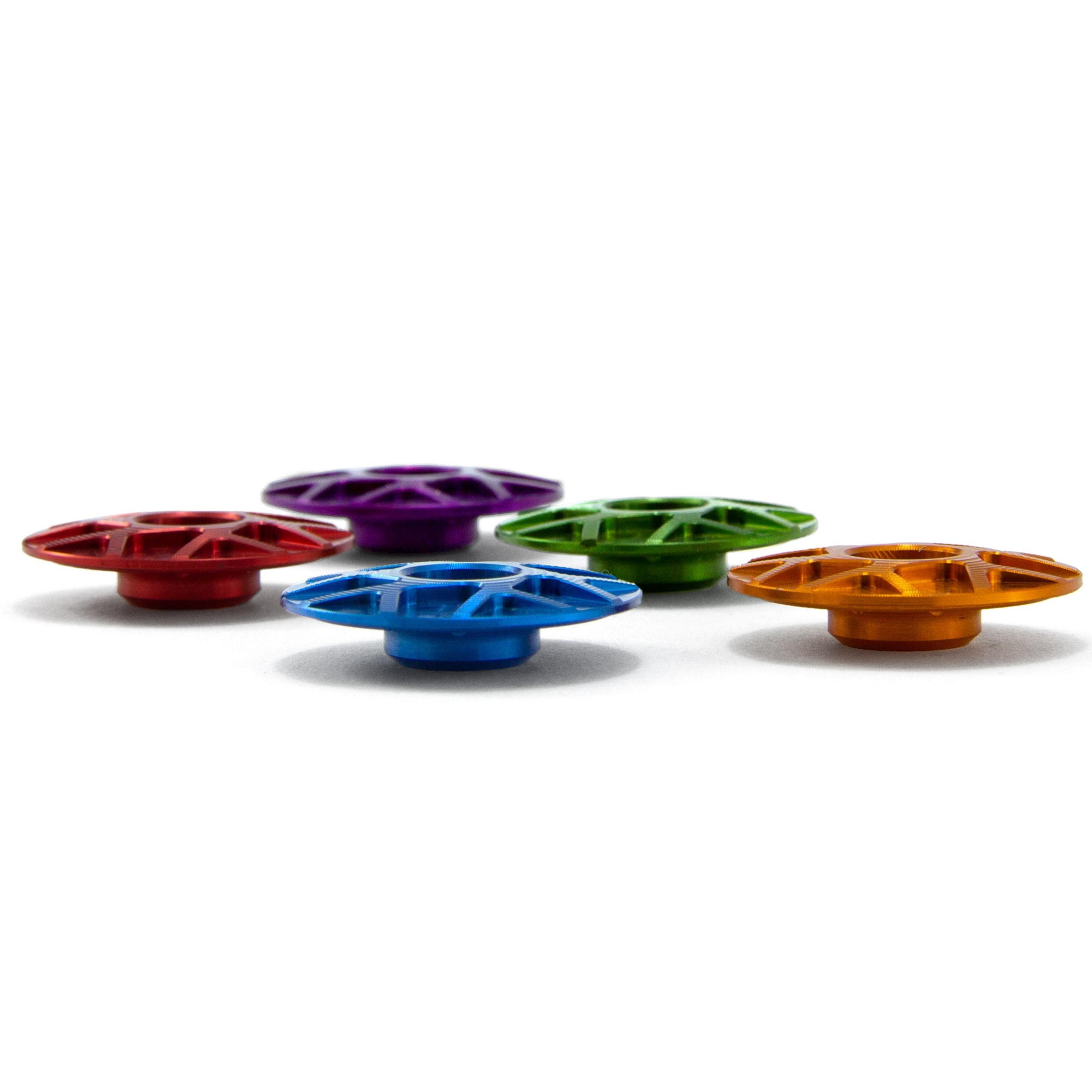 Side view of Garbaruk top caps in a range of colours, highlighting anodised finish and CNC detailing