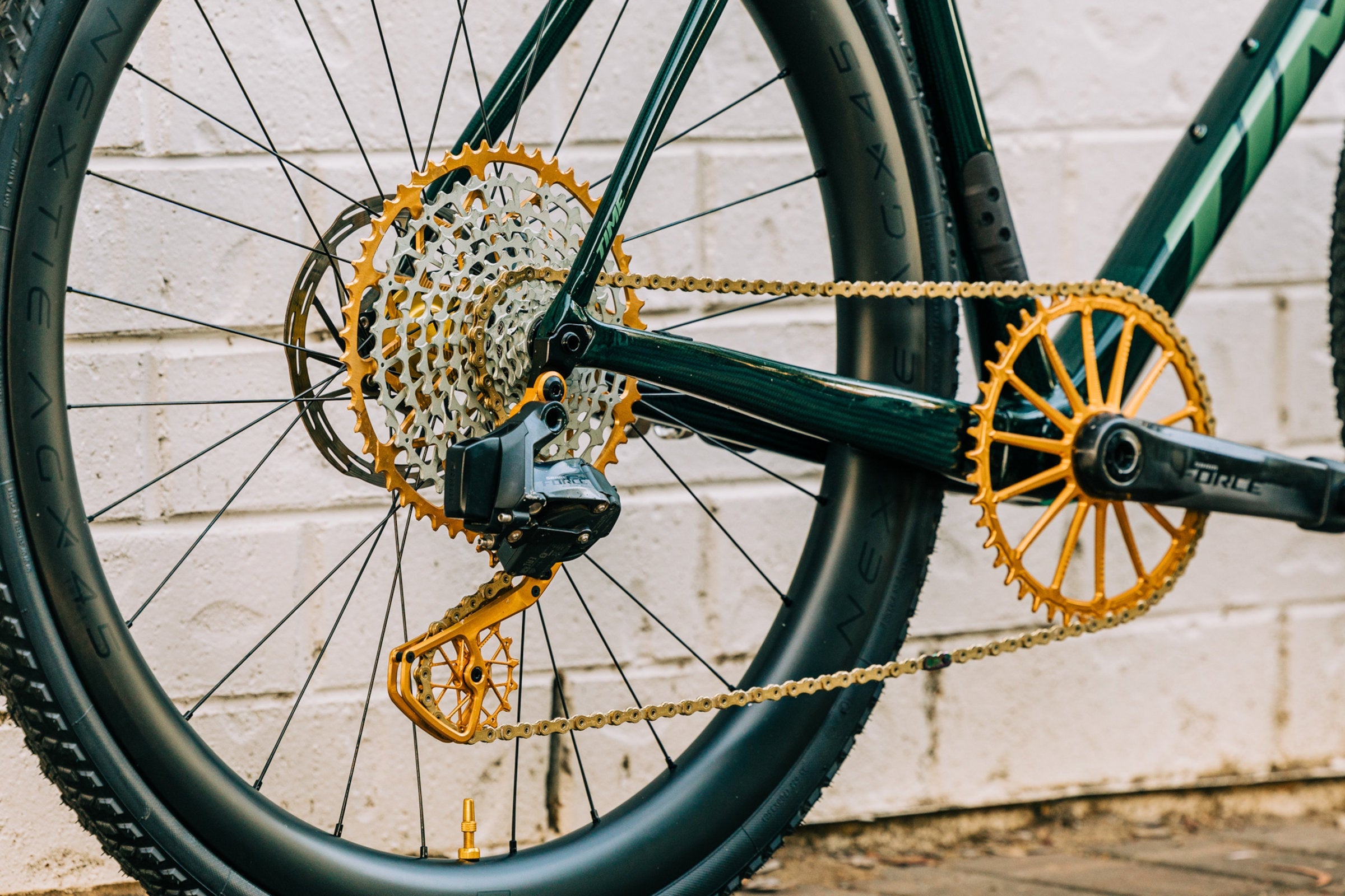 Gold Garbaruk components fitted to a green Time carbon gravel bike.