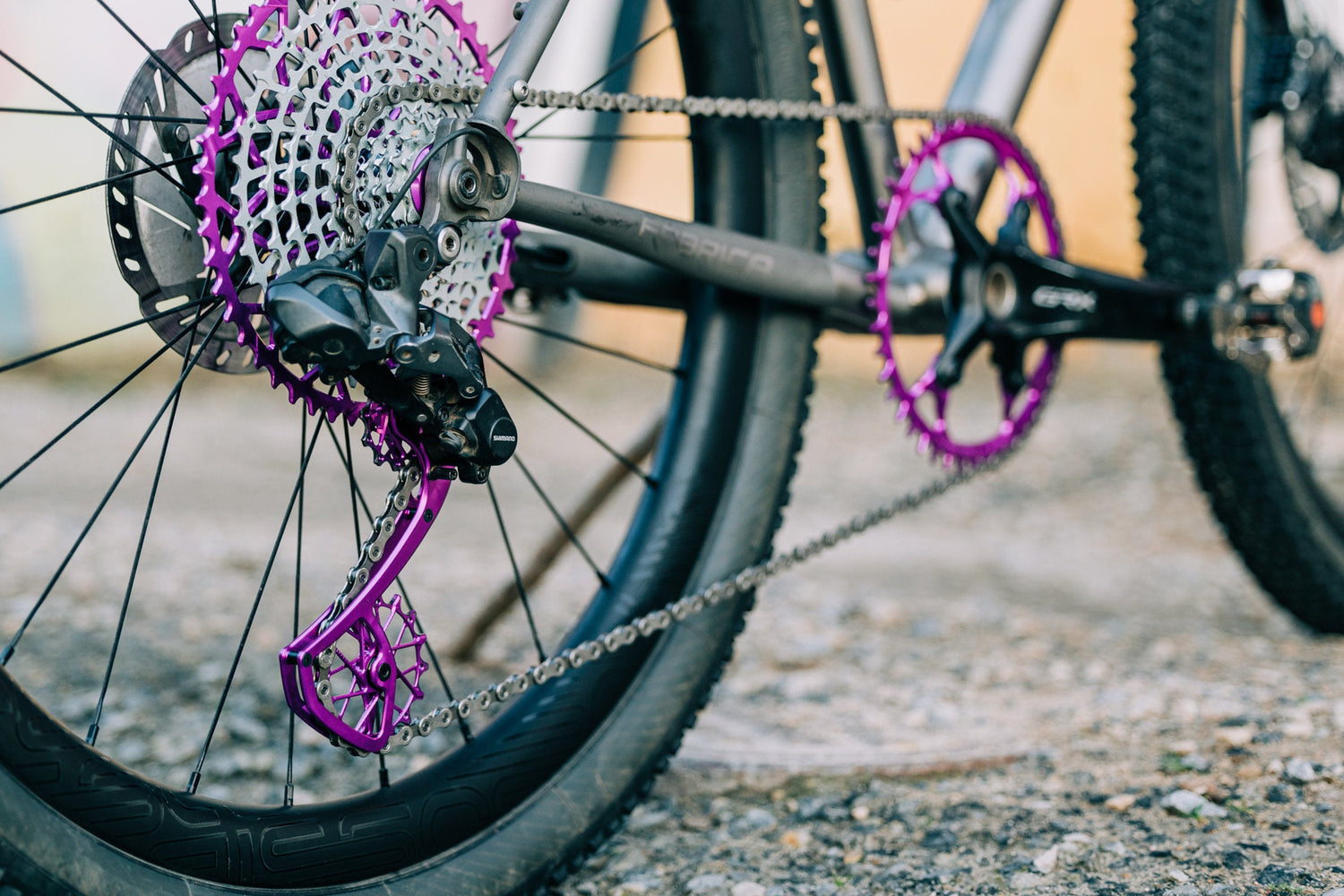 Purple Garbaruk drivetrain components fitted to a titanium Bossi gravel bike.