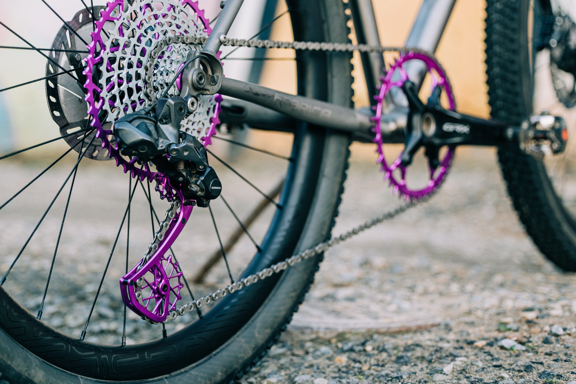 Purple Garbaruk drivetrain components fitted to a titanium Bossi gravel bike.