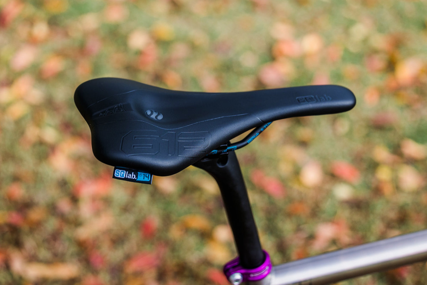 An SQLab 612 saddle fitted to a titanium bicycle, photographed outside