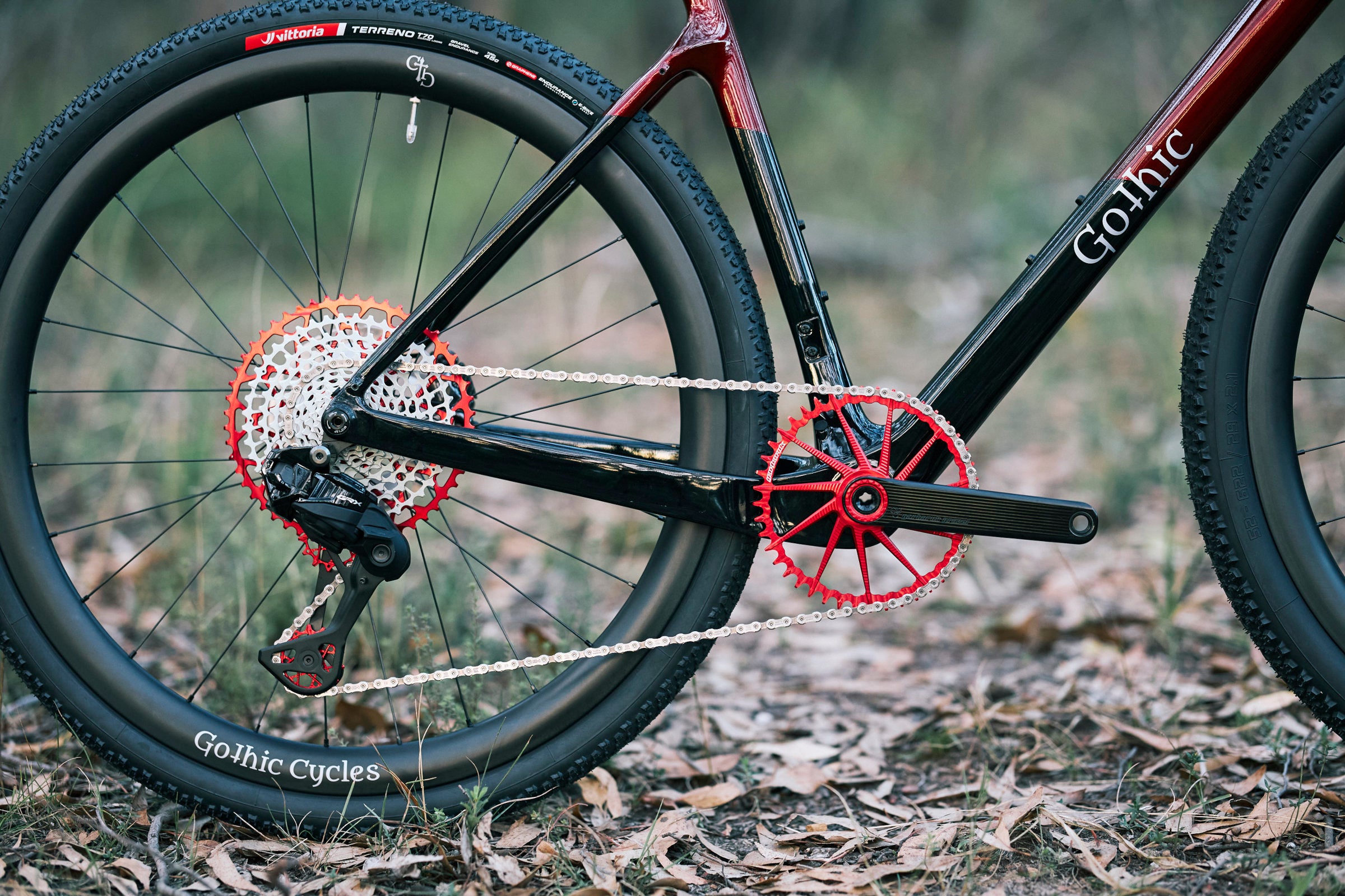 Rd and black Garbaruk drivetrain components, fitted to a carbon Gothic Cycles gravel bike.
