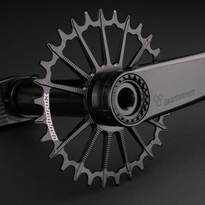Garbaruk DM MTB chainring in black, designed for mountain bike cranksets, showing precise CNC machining, mounted to a black Garbaruk crankset
