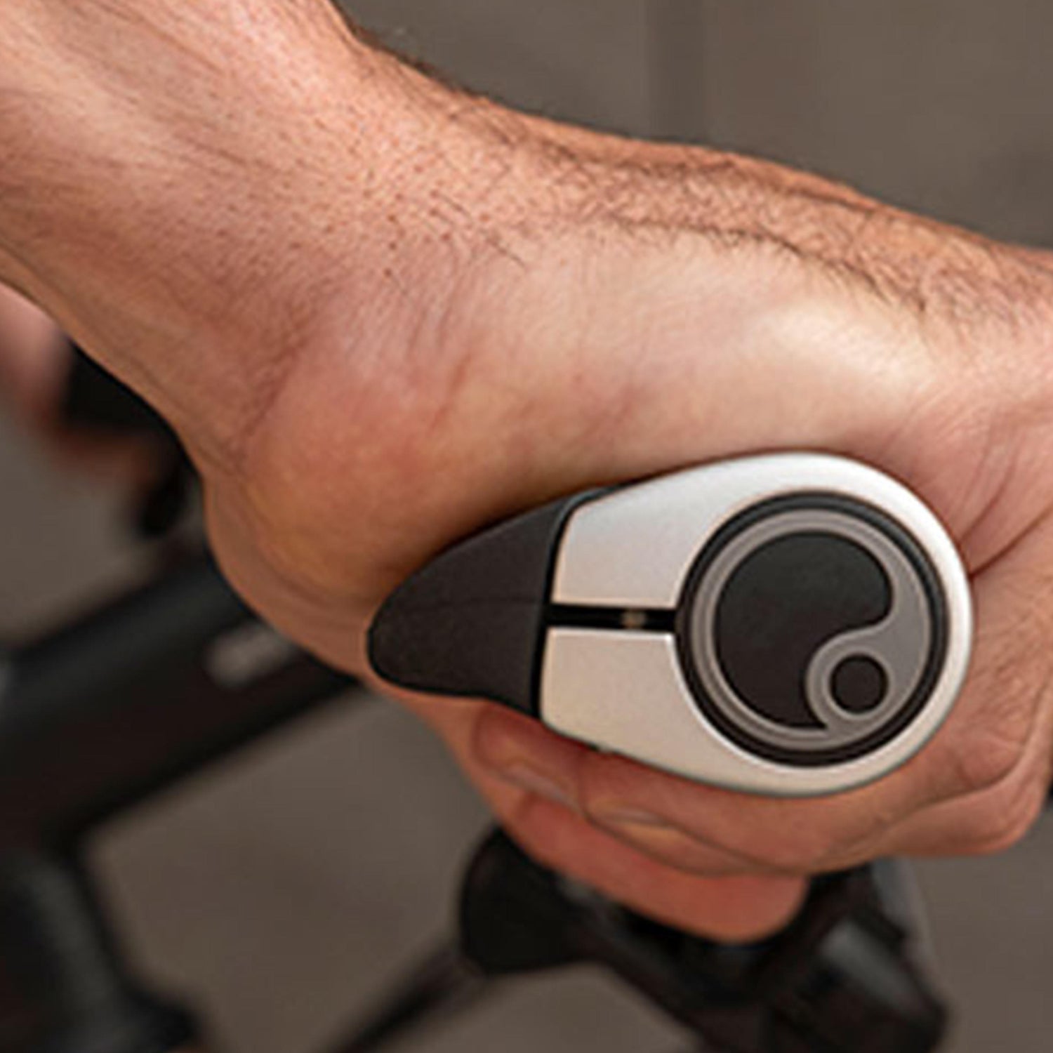 Close-up of a rider’s hand on an Ergon GP1 Evo grip, showing ergonomic hand positioning