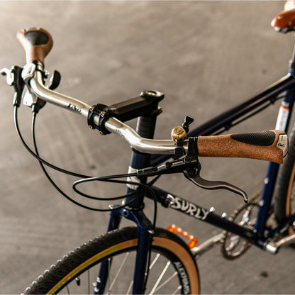 Ergon GC1 BioKork grips installed on a curved handlebar of a custom-built Surly Straggler commuter bike