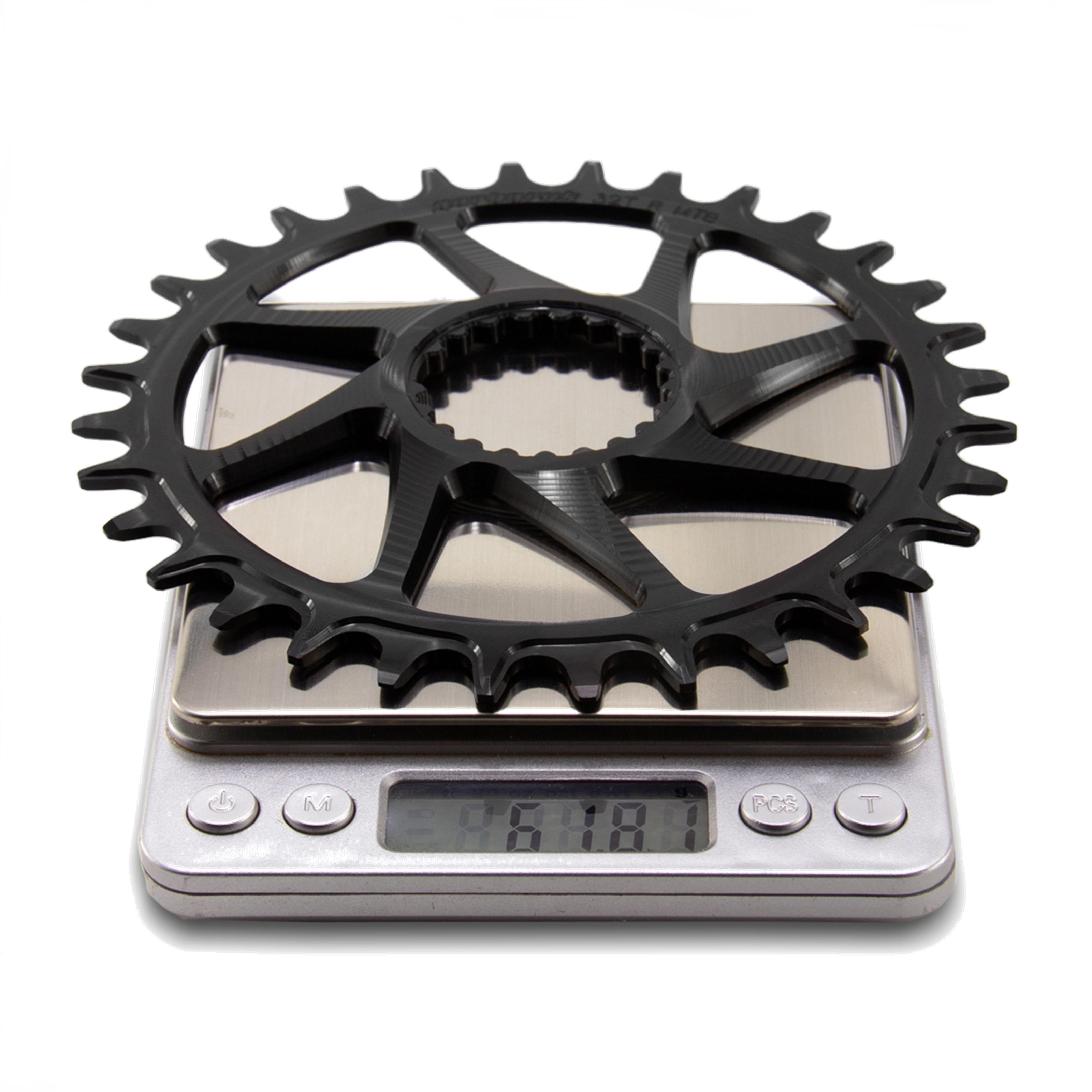 Black Garbaruk DM MTB chainring for Shimano displayed on a digital scale to show precise weight measurement (61.81g)
