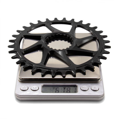 Black Garbaruk DM MTB chainring for Shimano displayed on a digital scale to show precise weight measurement (61.81g)