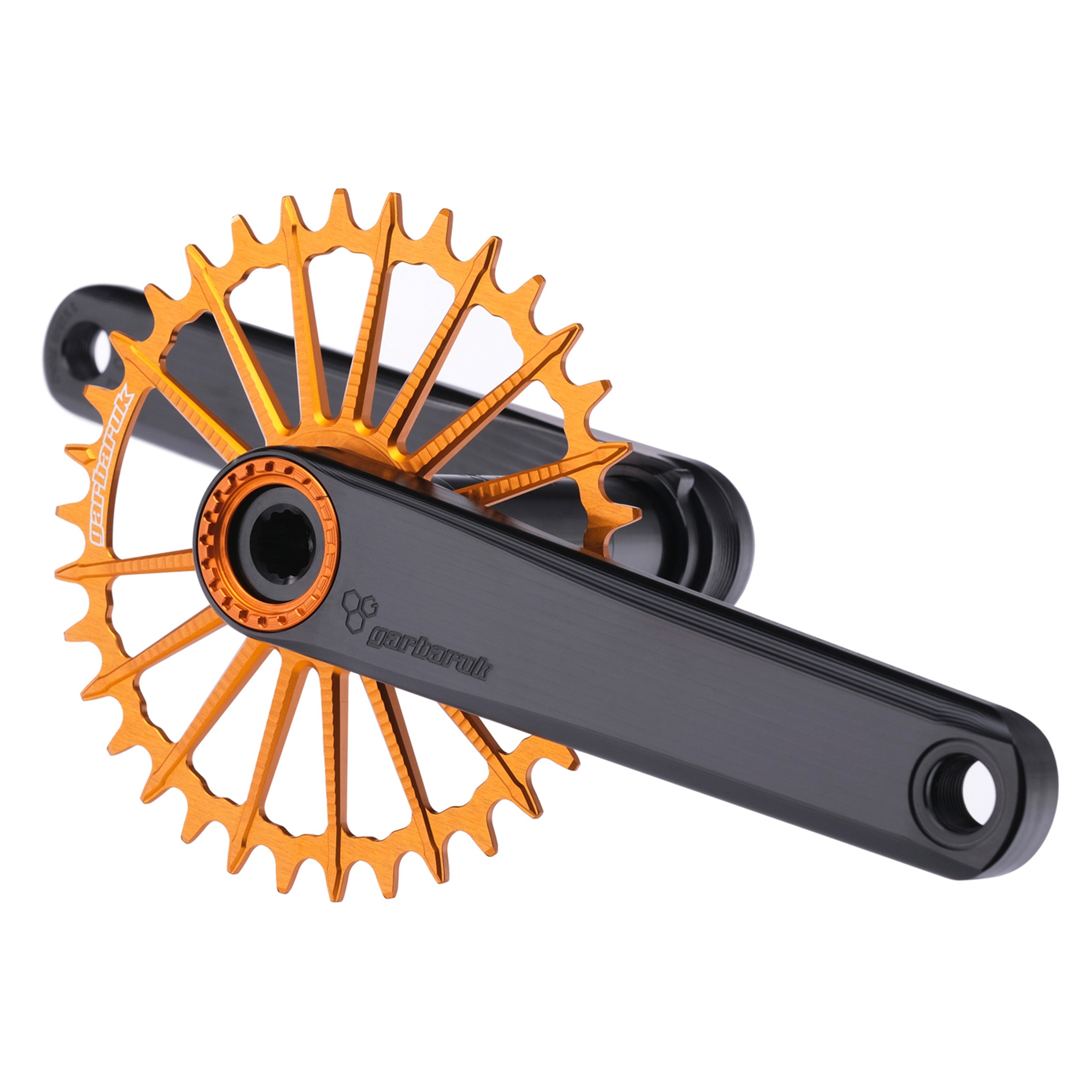 Garbaruk XC crankset in black with orange Garbaruk chainring, showing minimalist MTB design and CNC-machined detail