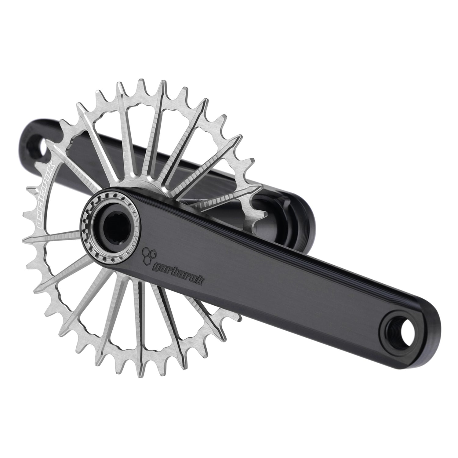 Garbaruk XC crankset in black with silver Garbaruk chainring, showing minimalist MTB design and CNC-machined detail
