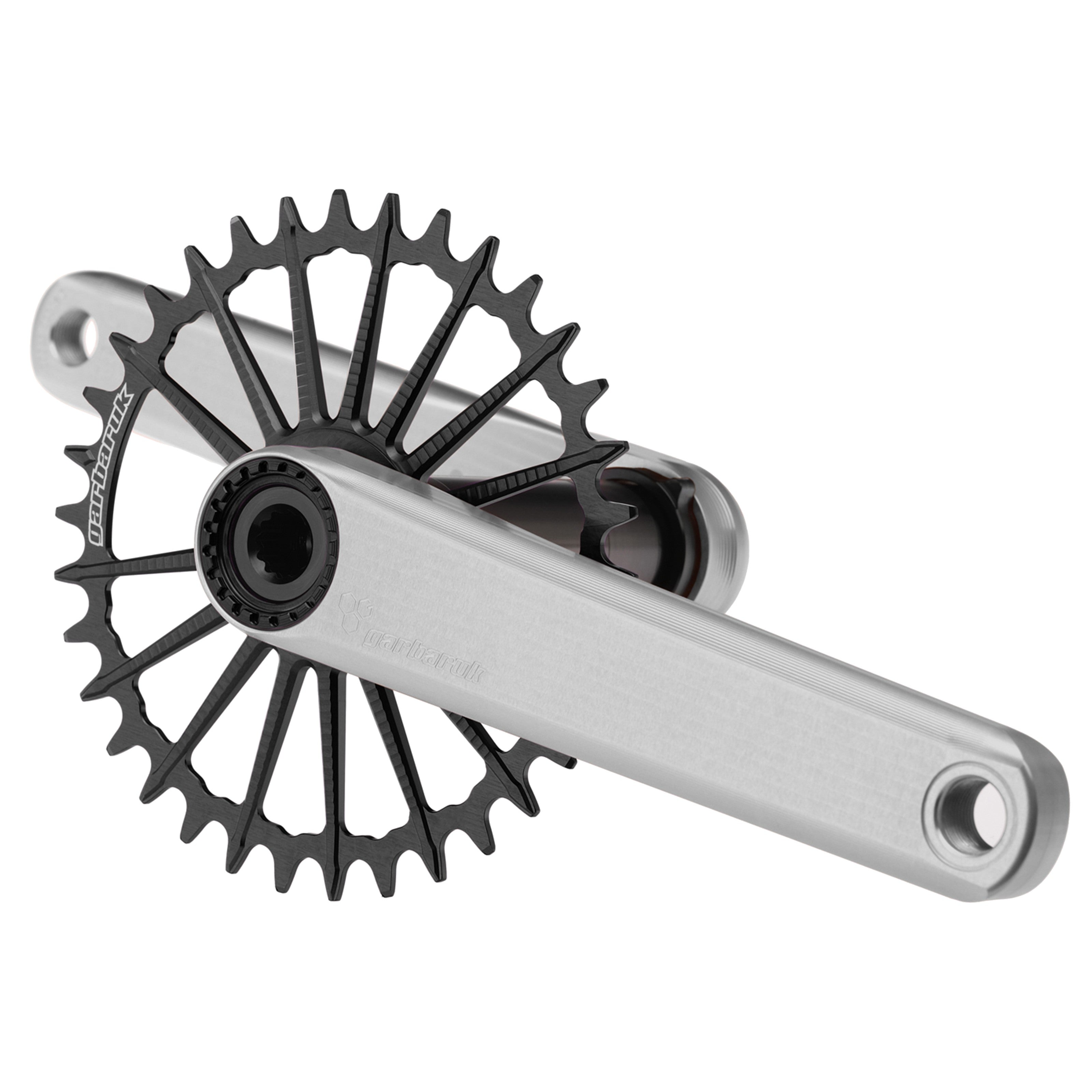 Silver Garbaruk XC crankset with black Garbaruk chainring, engineered for lightweight MTB performance and precision