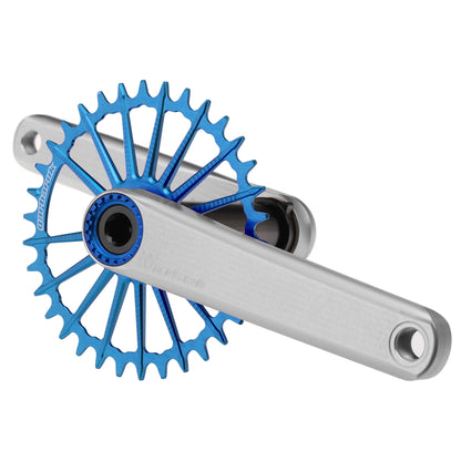 Silver Garbaruk XC crankset with blue Garbaruk chainring, engineered for lightweight MTB performance and precision