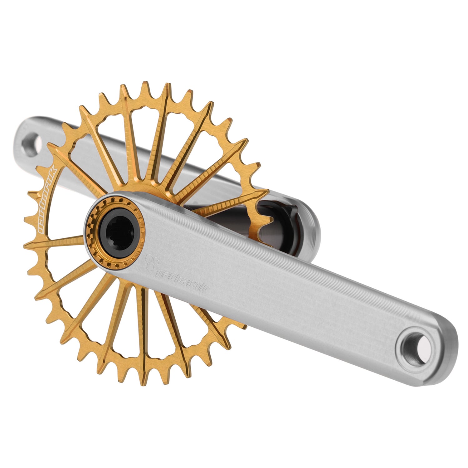 Silver Garbaruk XC crankset with gold Garbaruk chainring, engineered for lightweight MTB performance and precision