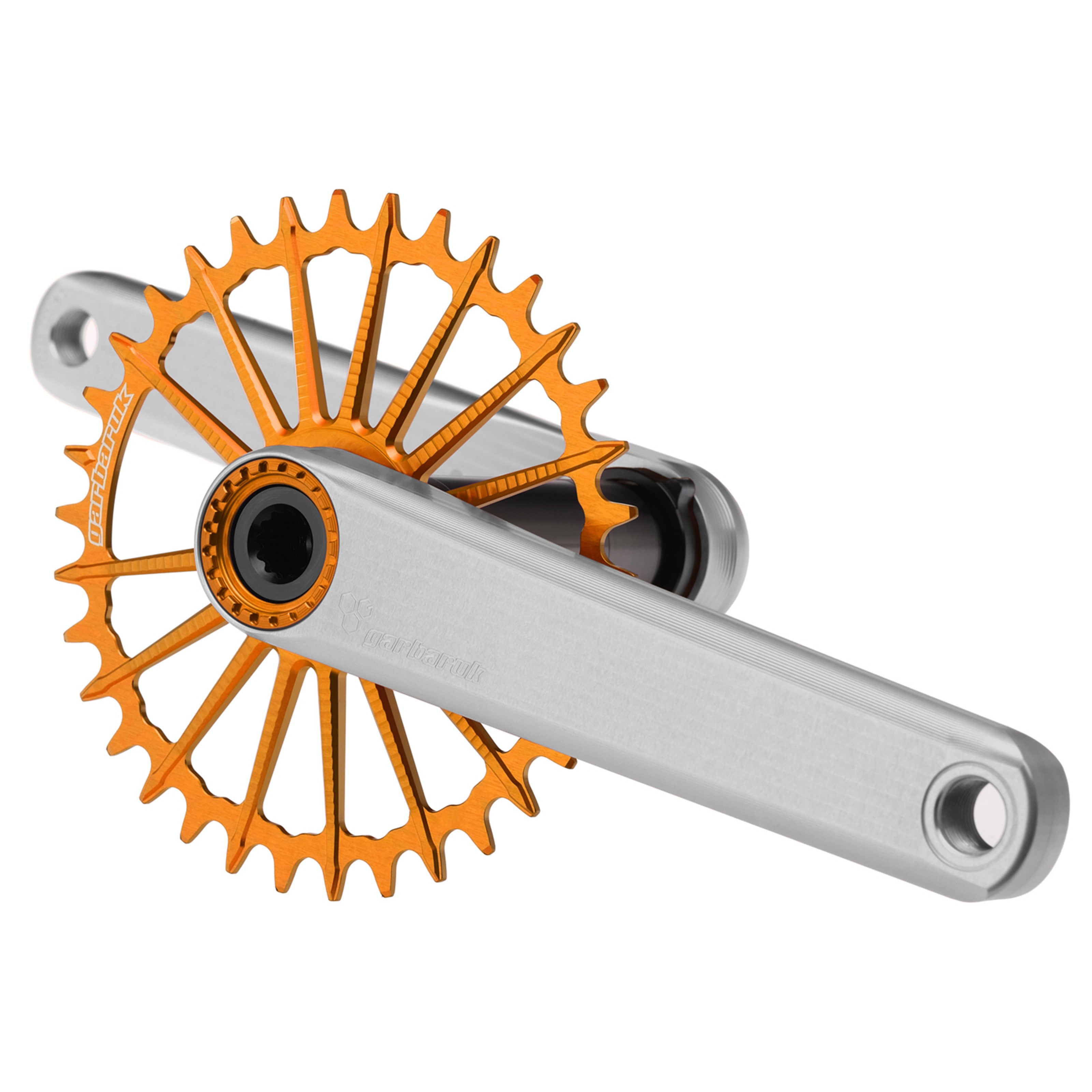 Silver Garbaruk XC crankset with orange Garbaruk chainring, engineered for lightweight MTB performance and precision