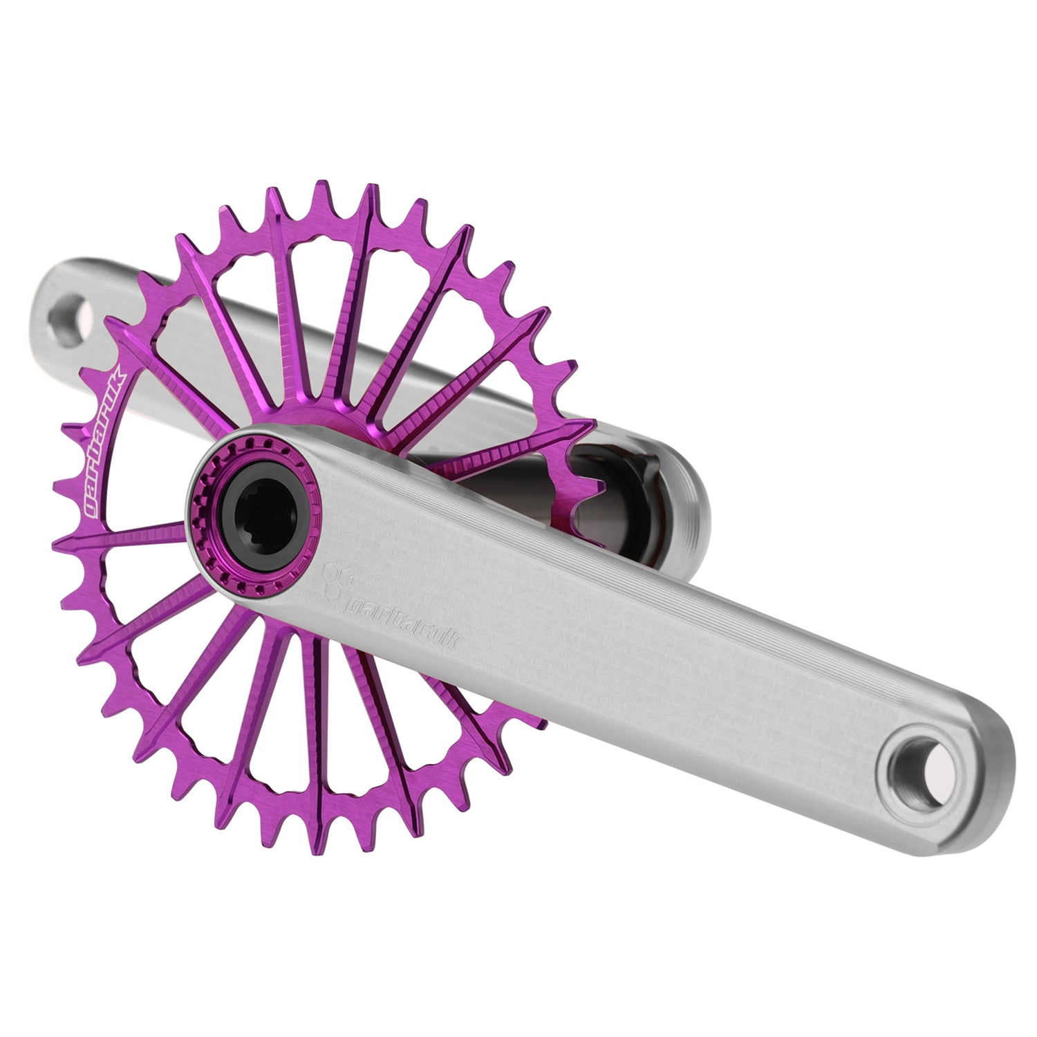 Silver Garbaruk XC crankset with purple Garbaruk chainring, engineered for lightweight MTB performance and precision