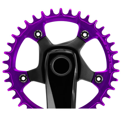 Close-up of black Garbaruk chainring bolts installed on violet Garbaruk chainring, highlighting colour contrast and secure fit