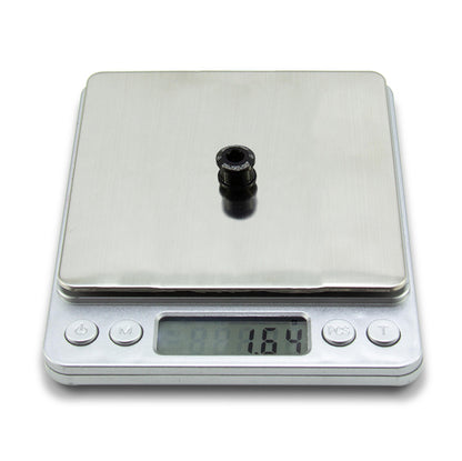 Black Garbaruk chainring bolt on digital scale showing individual weight (1.64g)