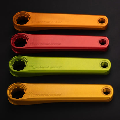 Garbaruk crank arms shown in different colours, highlighting anodised finish and lightweight, performance-driven design