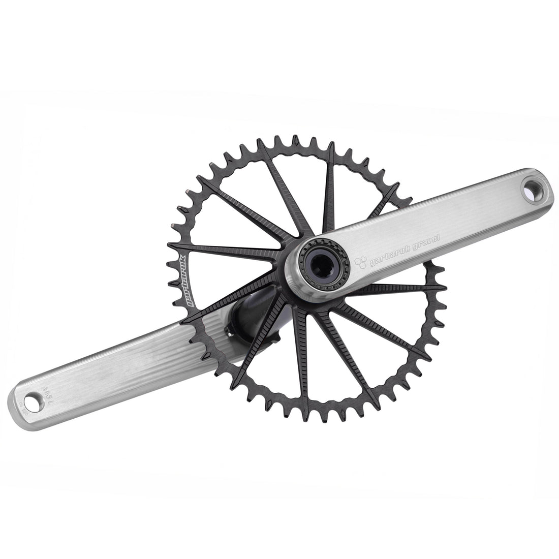 Garbaruk road/gravel crankset in silver with a black Garbaruk chainring installed, showcasing CNC-machined design and minimalist aesthetics