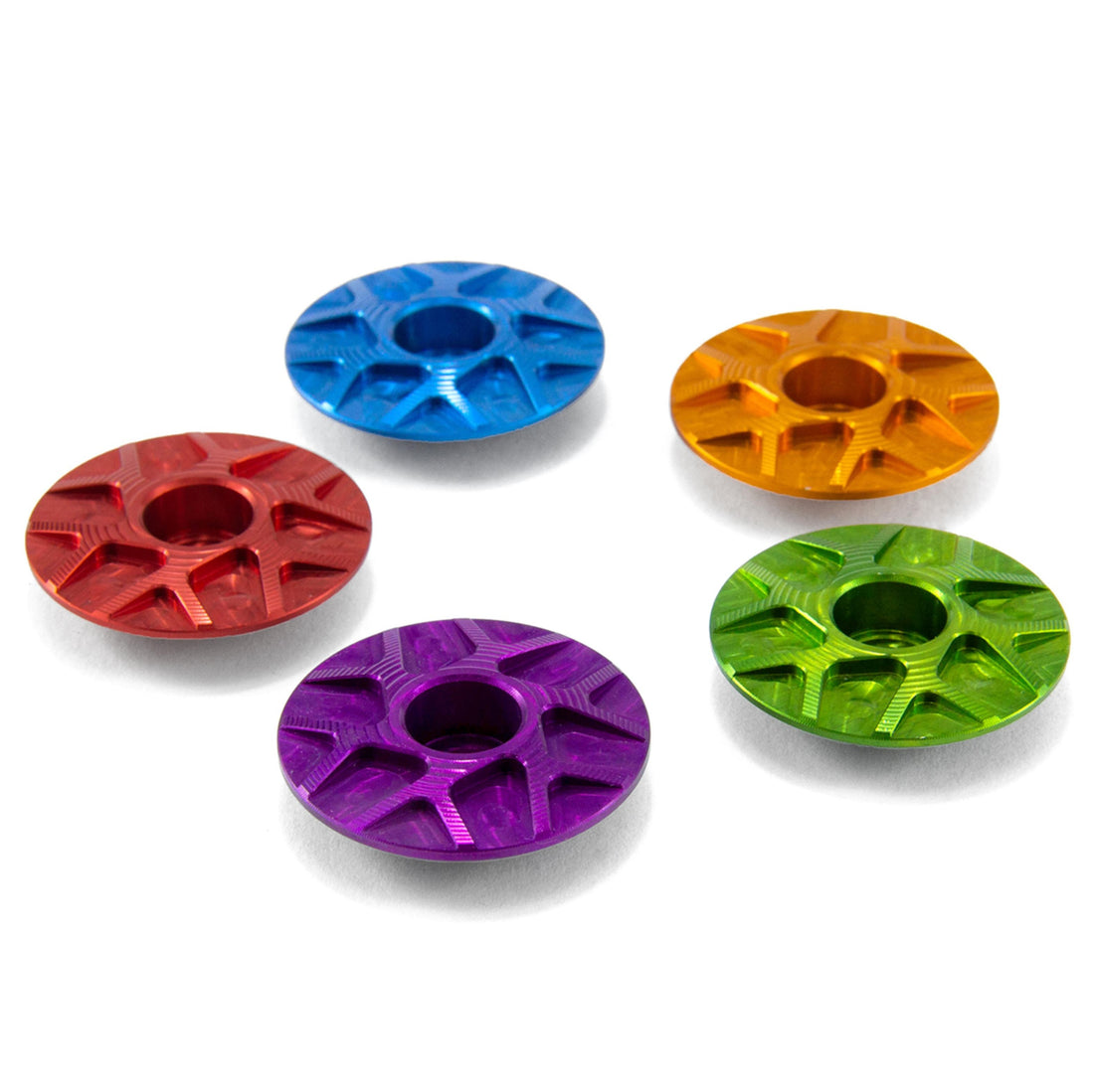 A collection of Garbaruk stem caps in assorted colours, highlighting the CNC-machining and quality