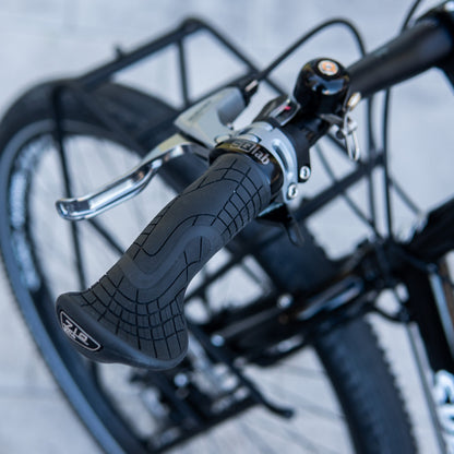 SQLab 710 grips installed on a custom-built Surly Ogre, photographed outdoors against a concrete floor