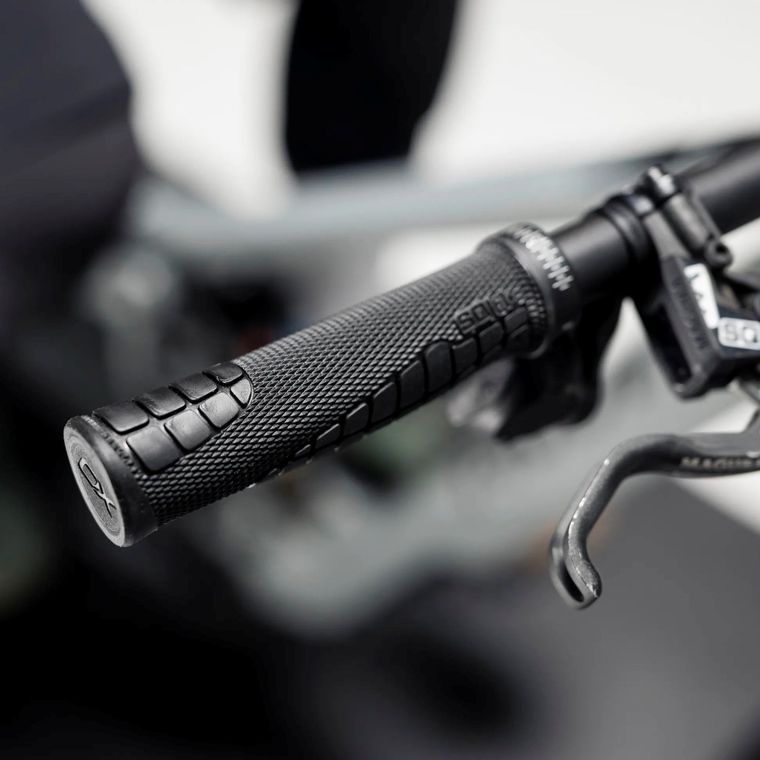 SQLab 70X 2.0 mountain bike grip fitted to a black mountain bike handlebar.